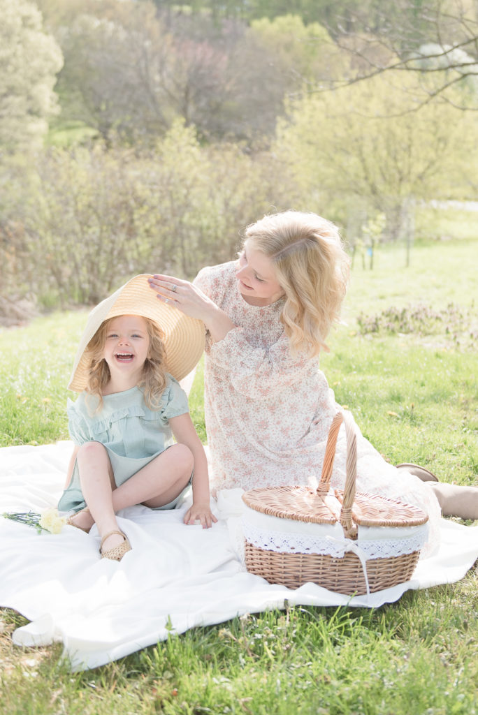 best locations for family photos in rochester, new york - mom and daughter on picnic blanket outdoors