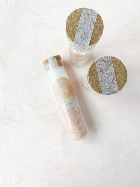 Pink bath salts in glass vials from Norabloom's New York spa