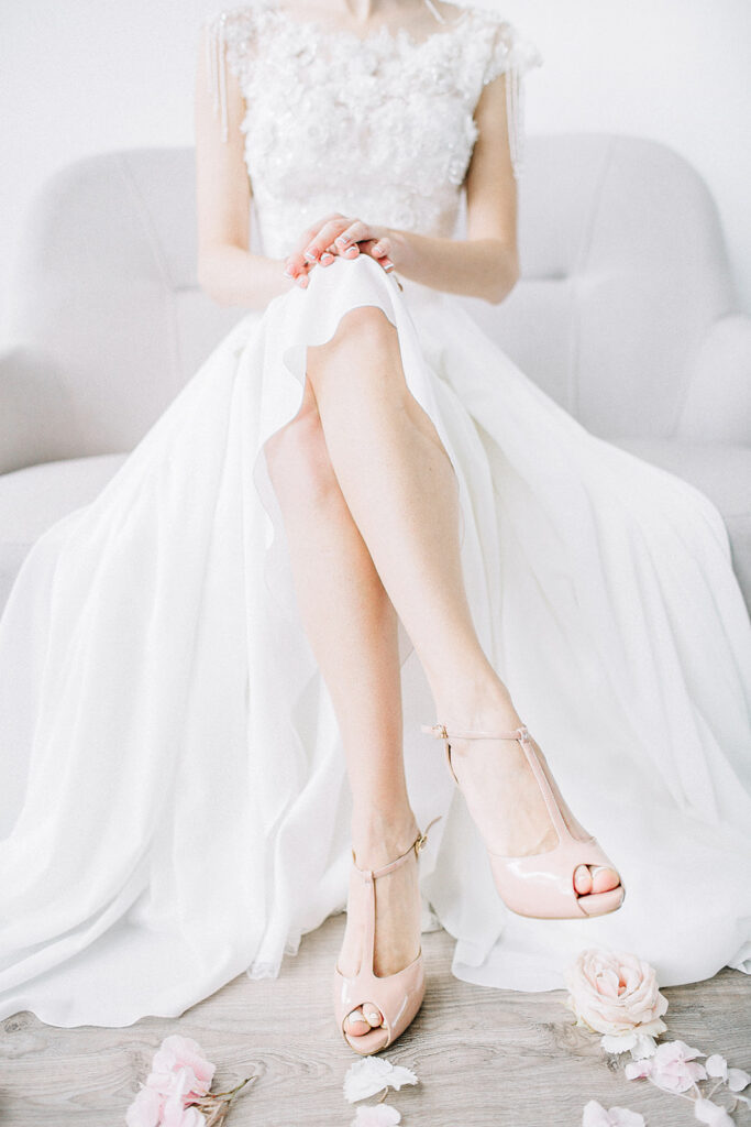 Planning guide for brides, woman in bridal gown seated with legs crossed
