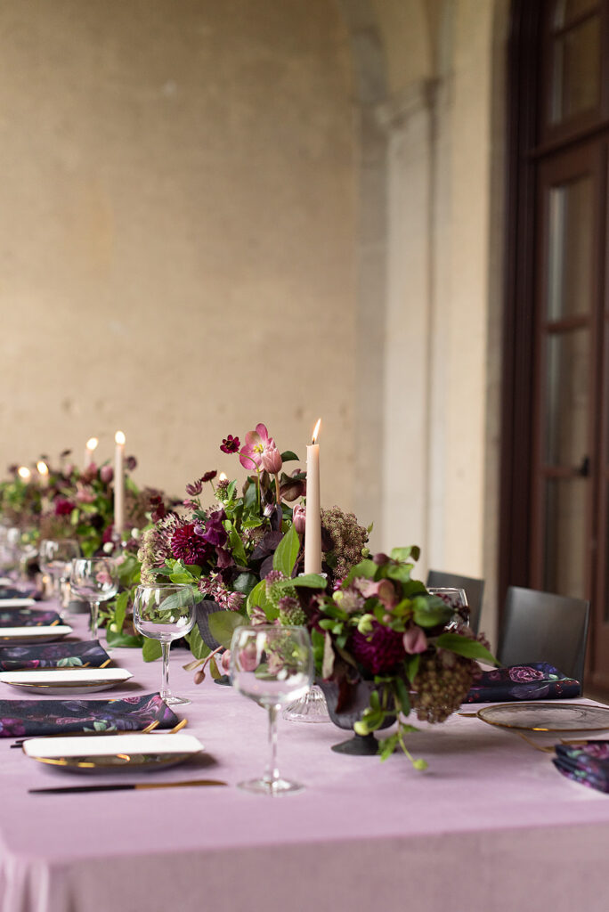 Wedding reception with candles and floral arrangements on table